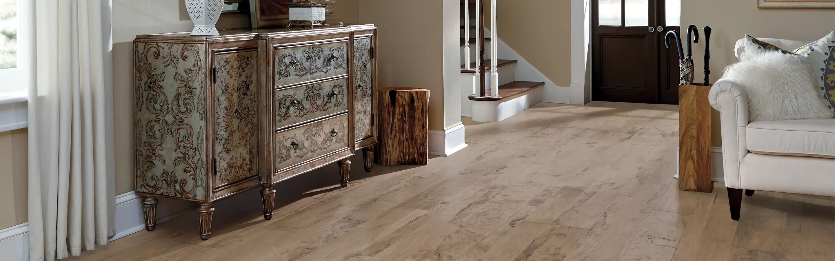 hardwood flooring in entryway and living room